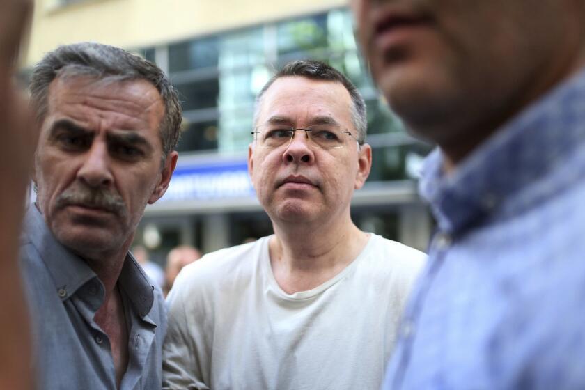 FILE - In this July 25, 2018 file photo, Andrew Craig Brunson, an evangelical pastor from Black Mountain, North Carolina, arrives at his house in Izmir, Turkey. An American pastor may soon be released after two years of captivity in Turkey. A person involved in efforts to free Andrew Brunson say the 50-year-old pastor from North Carolina could be freed at his next court appearance on Friday. The person spoke on condition of anonymity because officials had not yet reached a final agreement on the release and it could still fall through. Brunson was among thousands of people arrested following a failed July 2016 coup against the Turkish president. (AP Photo/Emre Tazegul, File)