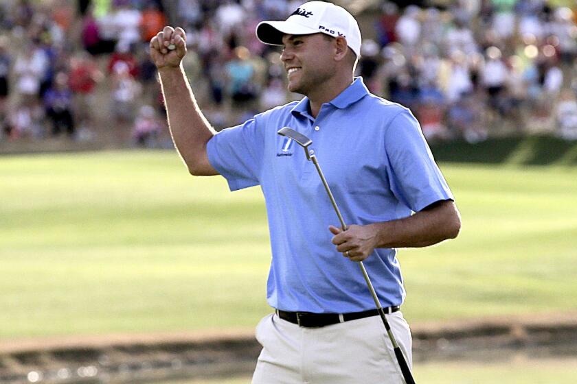 Bill Haas celebrates after winning the Humana Challenge golf tournament on Sunday in La Quinta.