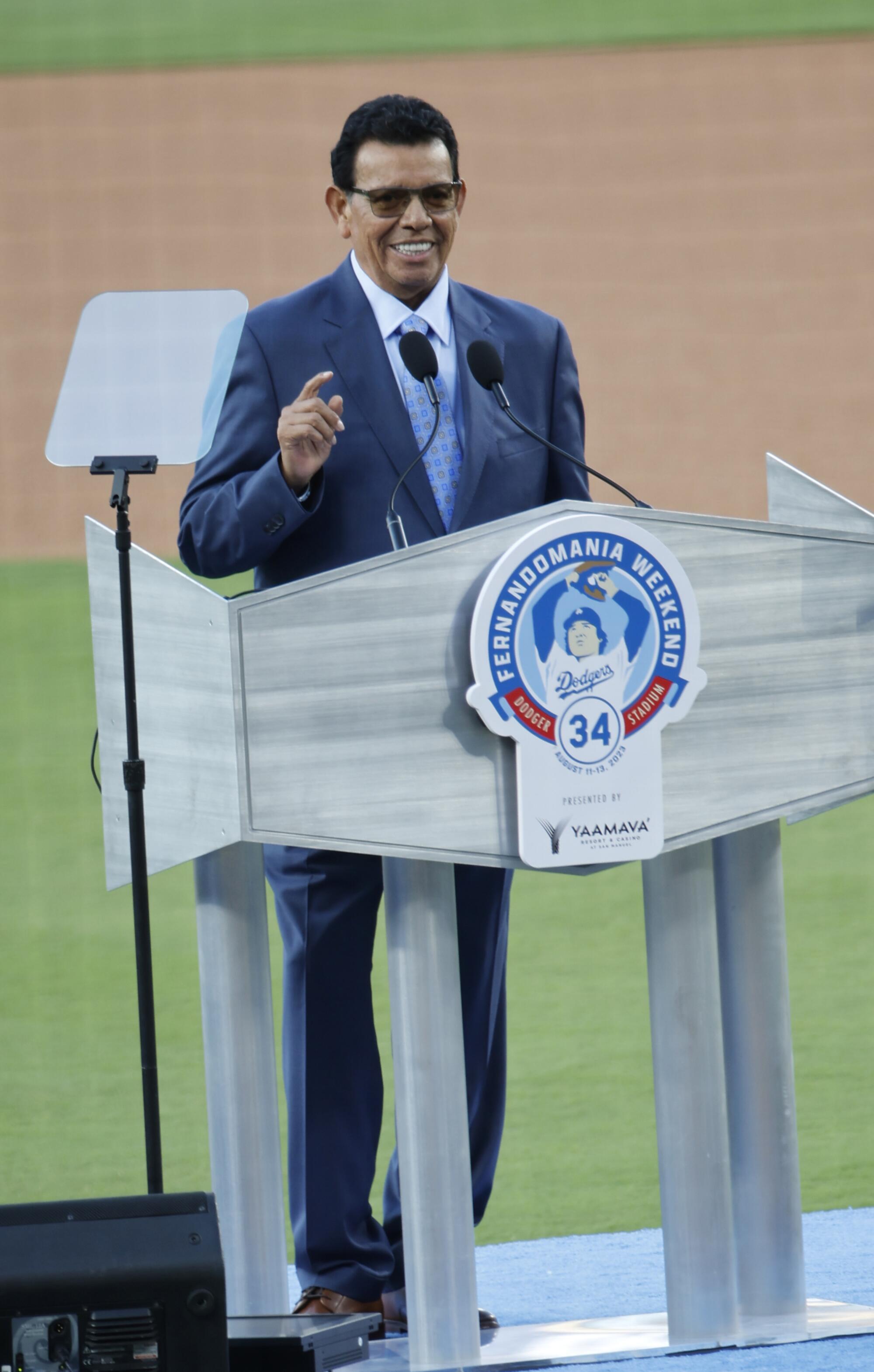 Dodgers legend Fernando Valenzuela addresses the crowd during his jersey retirement ceremony at Dodger Stadium.