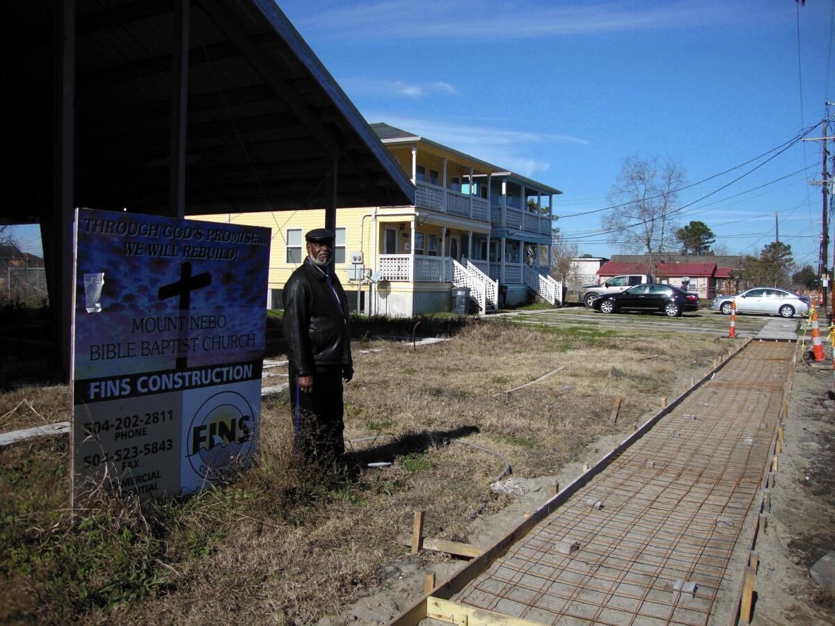 The Rev. Charles Duplessis outside the church he is rebuilding in New Orleans' Lower 9th Ward.