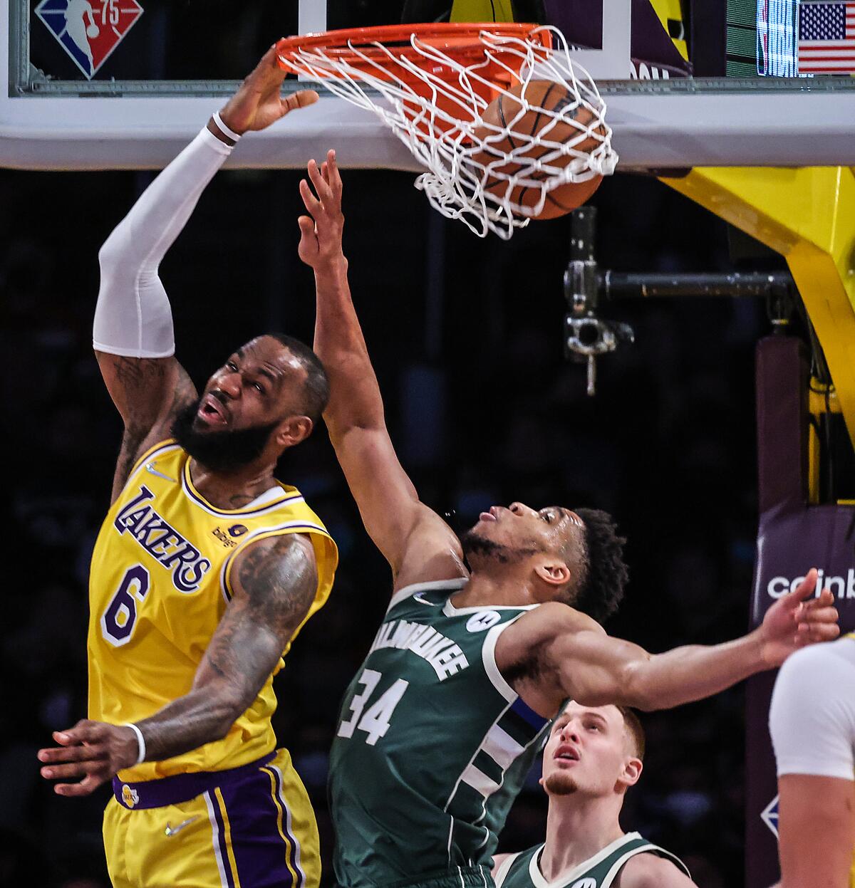 James scores 34 points as Lakers open long trip by beating Bucks