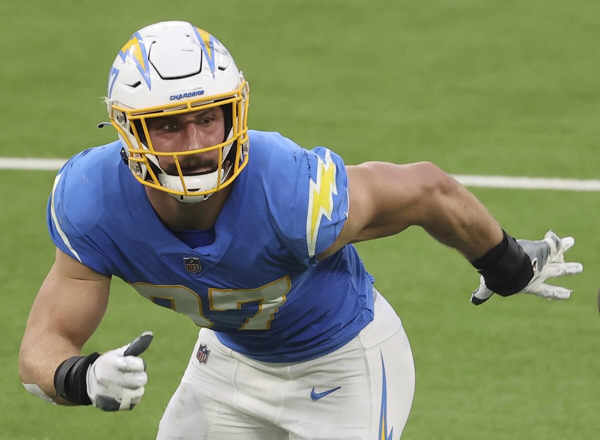 Chargers defensive end Joey Bosa chases after the ball.