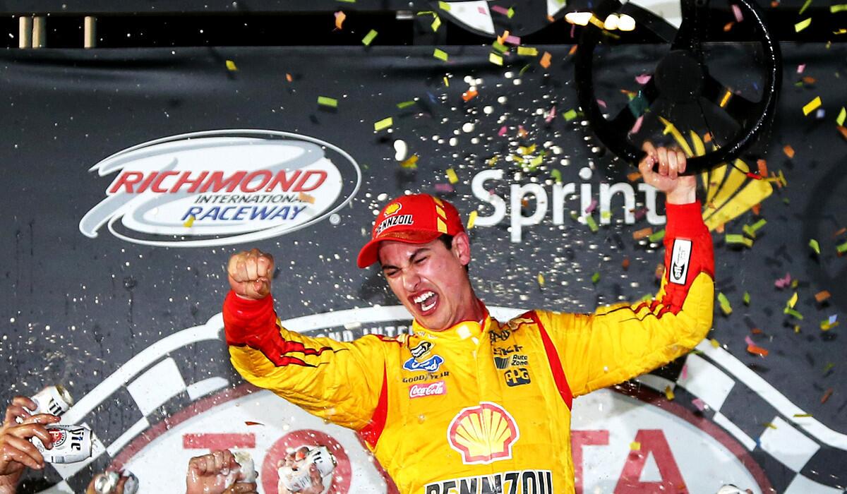 NASCAR driver Joey Logano celebrates in Victory Lane after winning the Sprint Cup Series Toyota Owners 400 at Richmond International Raceway on Saturday night.