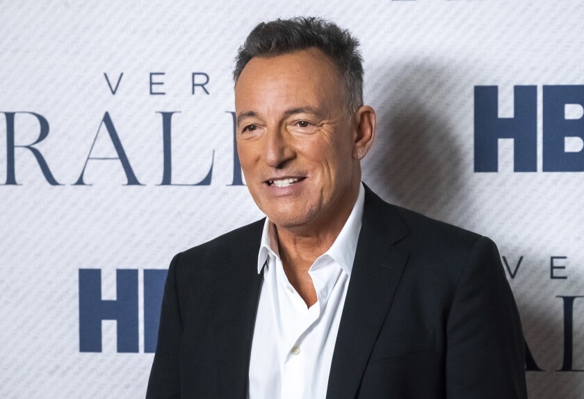Bruce Springsteen in a dark sport coat and white shirt