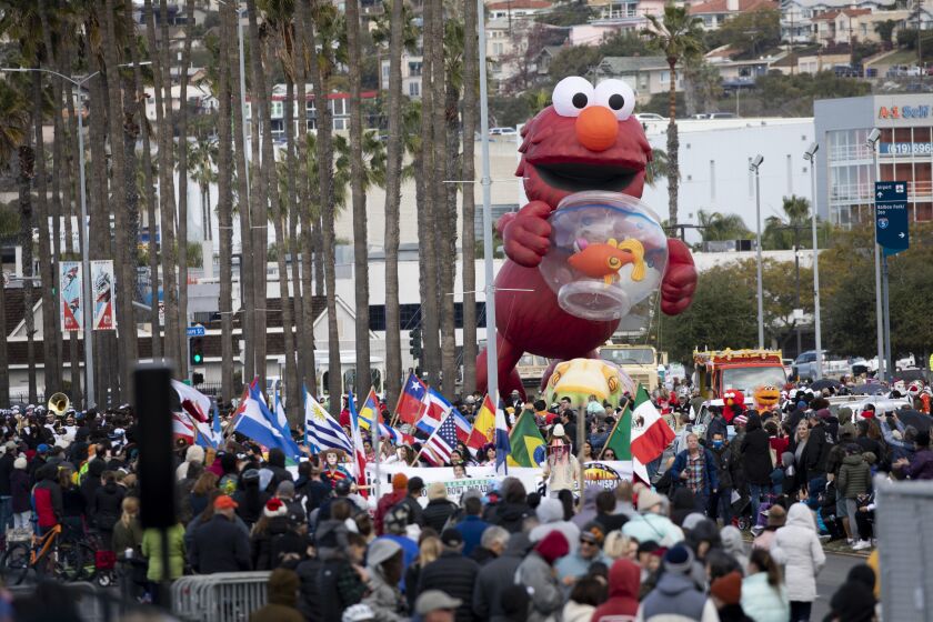 Elmo makes his way down Harbor Drive during the Port of San Diego Holiday Bowl Parade.