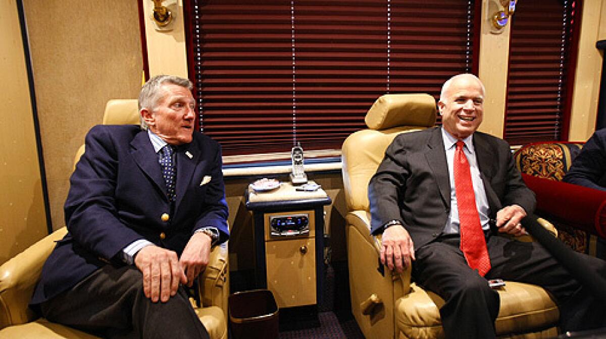 Republican presidential candidate, Sen. John McCain, right, and former Navy Secretary John Lehman speak on McCain's campaign bus, Friday, March 14, 2008, after a town hall meeting in Springfield, Pa.