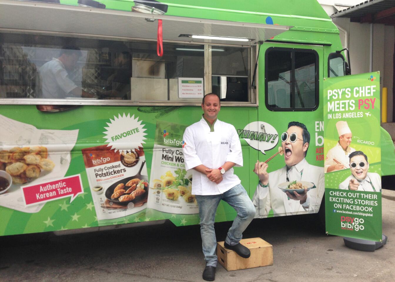 Ricardo Caput, winner of Psy's personal chef contest, stands in front of the food truck.