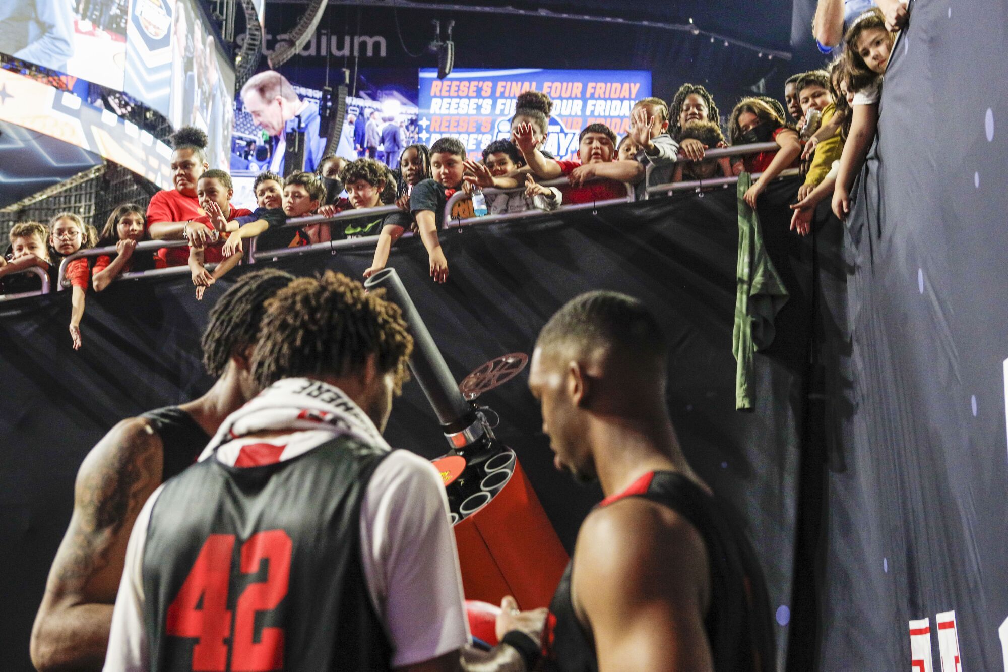 San Diego State players sign autographs 