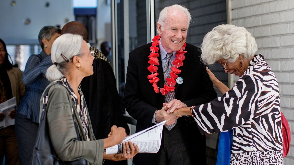 Actor Mike Farrell greets parishioners after speaking in support of Prop 62 at the Holman United Methodist Church. (Gina Ferazzi / Los Angeles Times)