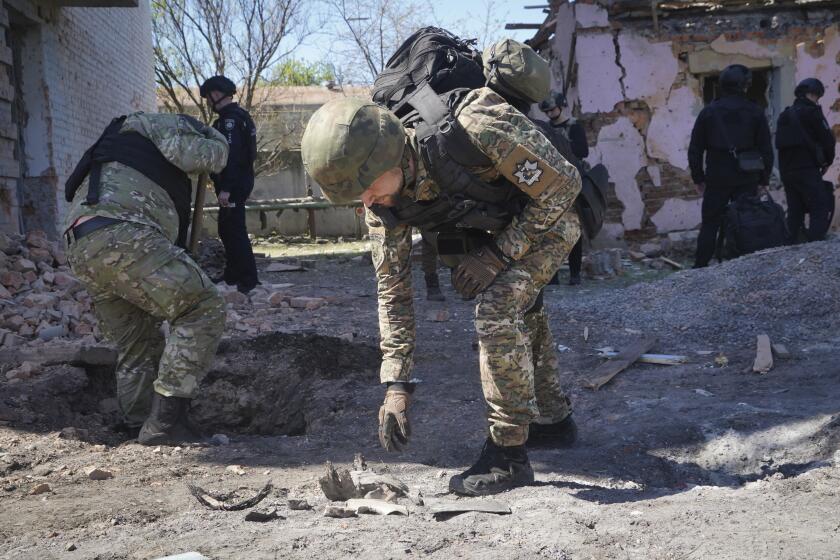 FILE - A police officer examines fragments of a guided bomb after the Russian air raid in Kharkiv, Ukraine, Tuesday, April 30, 2024. Russia pounded a town in 鲍办谤补颈苍别’s northeast with artillery, rockets and guided aerial bombs Friday May 10, 2024 before attempting an infantry breach of local defenses, authorities said, in a tactical switch that Kyiv officials have been expecting for weeks as the war stretches into its third year. (AP Photo/Andrii Marienko, File)
