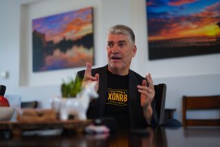 San Diego, CA - March 17: At his home in Ocean Beach on Friday, March 17, 2023 in San Diego, CA., Innocence Project director Justin Brooks and his new book, "You Might Go to Prison, Even Though You're Innocent." (Nelvin C. Cepeda / The San Diego Union-Tribune)