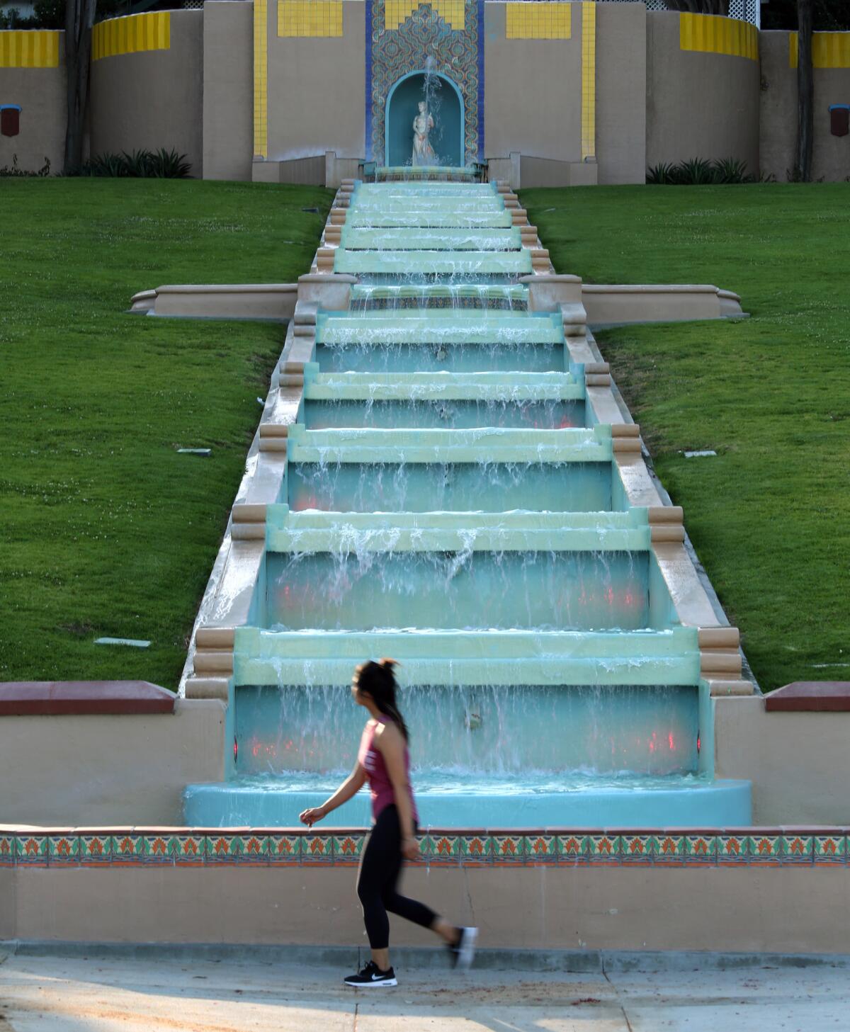 The multi-tiered fountain and the Athena statue that tops it are nostalgic reminders of the city's grand past, when a Greek developer named Peter Snyder decided to build Midwick View Estates, a luxury community of Spanish and Mediterranean style homes. (Glenn Koenig / Los Angeles Times)
