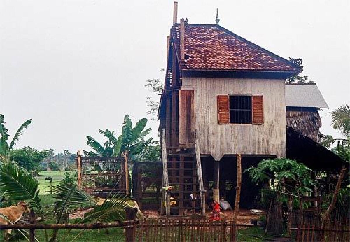 Half a house remains after husband Moeun Sarim took the bits and pieces of the portion of the house he shared with his wife Vat Navy.