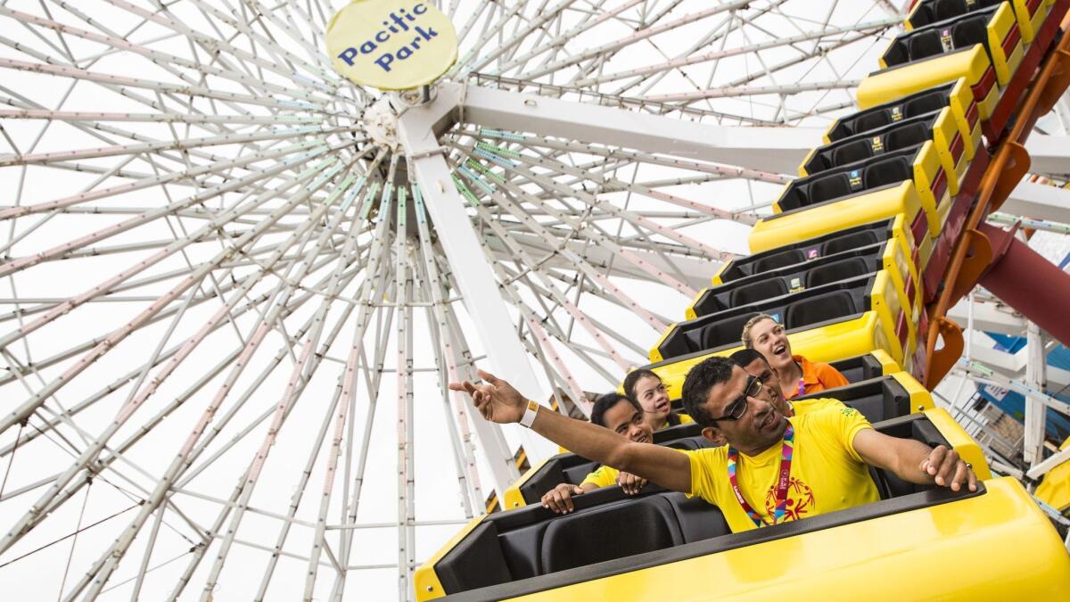 Special Olympics athlete Everton Silva of Brazil rides the West Roller Coaster at Pacific Park at the Santa Monica Pier in 2015.
