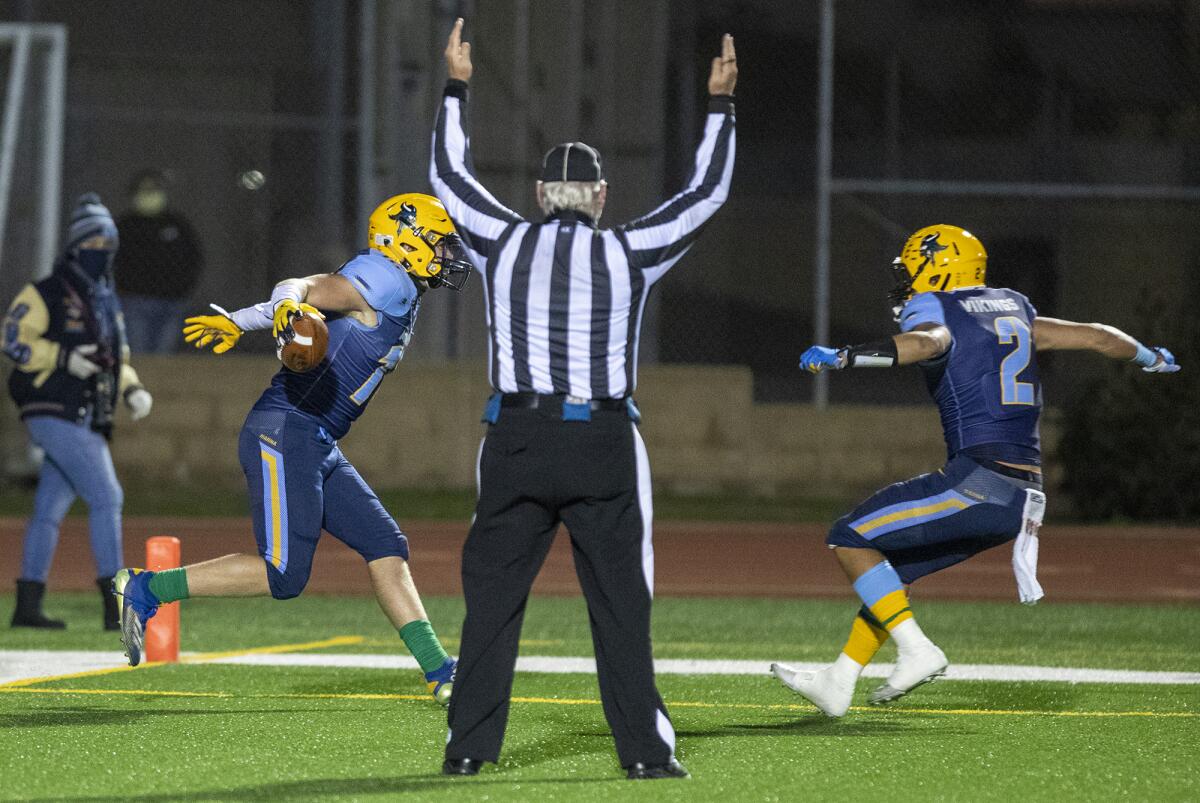Marina's Wyatt McClour celebrates a first-half touchdown with Gavin Del Toro during a game against Ocean View on Wednesday.
