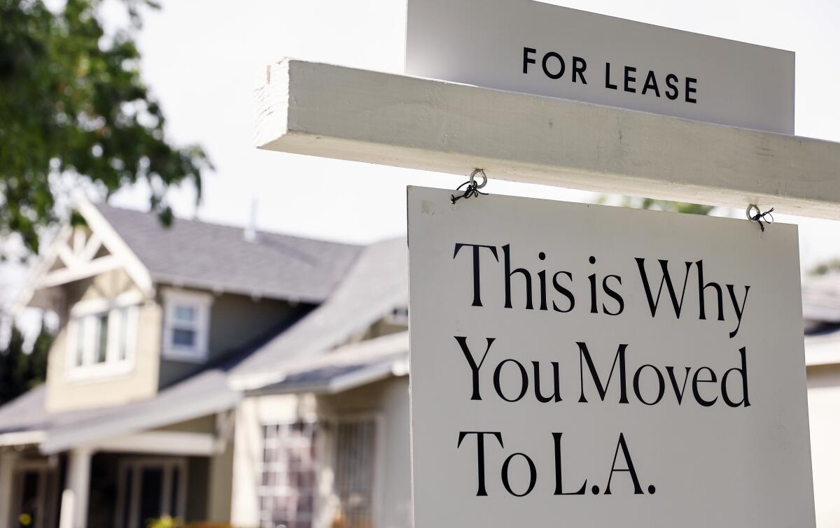 A "For Lease" sign is posted in front of a house available for rent in Los Angeles.