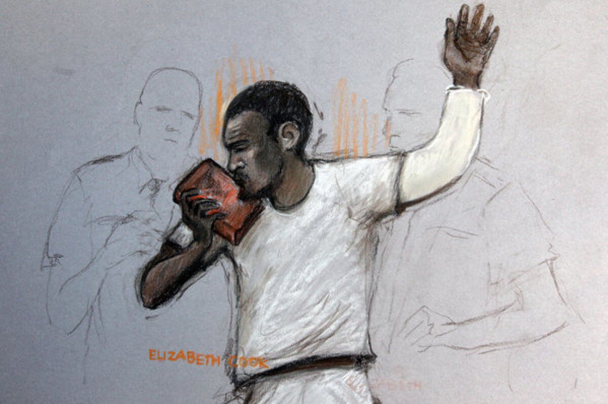 In this courtroom sketch, suspect Michael Adebolajo kisses the Koran as he appears at Westminster Magistrates Court in London. He is accused of killing British soldier Lee Rigby in an attack that prompted Prime Minister David Cameron to launch an investigation of Islamic radicalization in Britain.