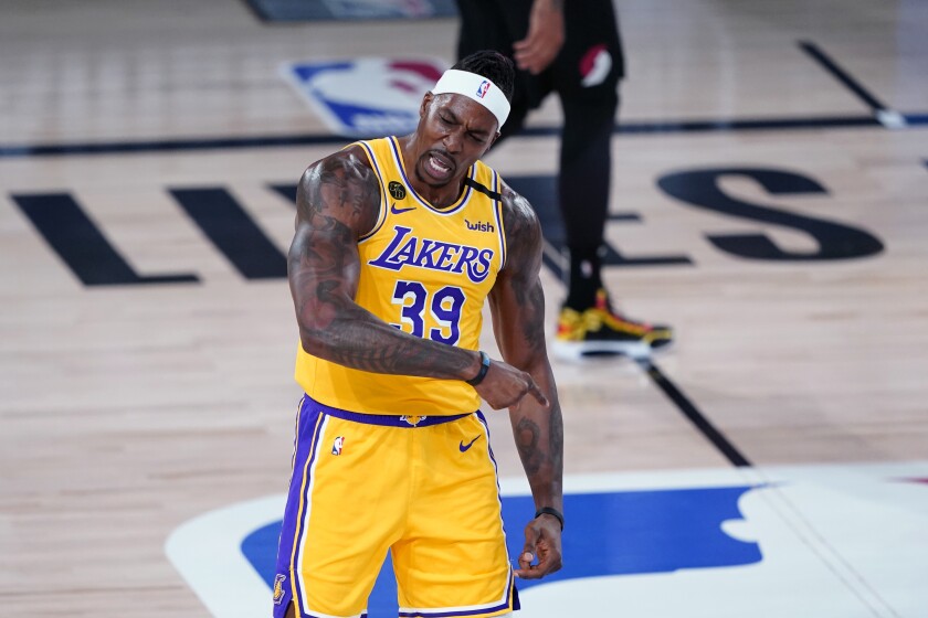 Lakers center Dwight Howard reacts after a slam dunk against the Portland Trail Blazers.
