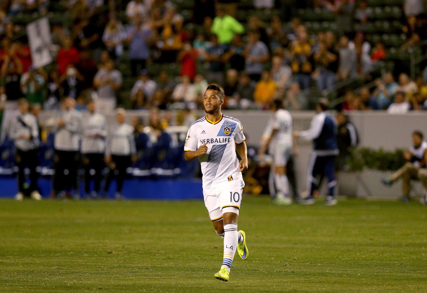 New Galaxy player Giovani Dos Santos takes the field against Central FC in the second half. He scored a goal in his debut with the team.