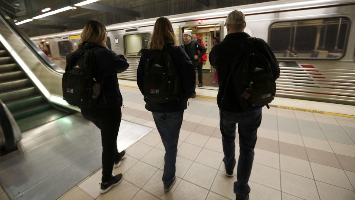 From left, Jennie Mauries, Karen Barnes and Andrew Tisbert with the homeless assistance group PATH embark on January's homeless count at a Red Line station.