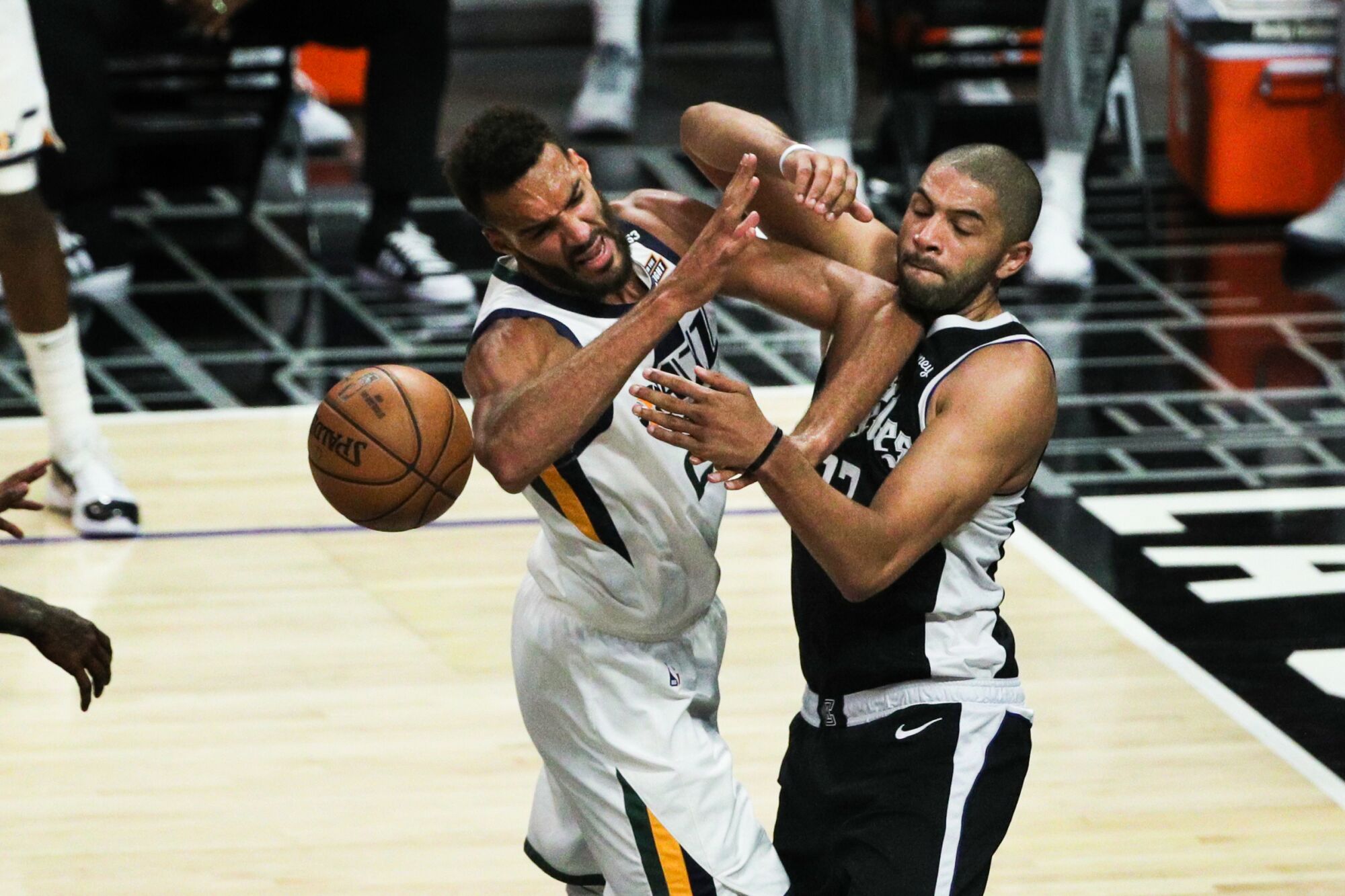 Clippers forward Nicolas Batum strips the ball from Jazz center Rudy Gobert.