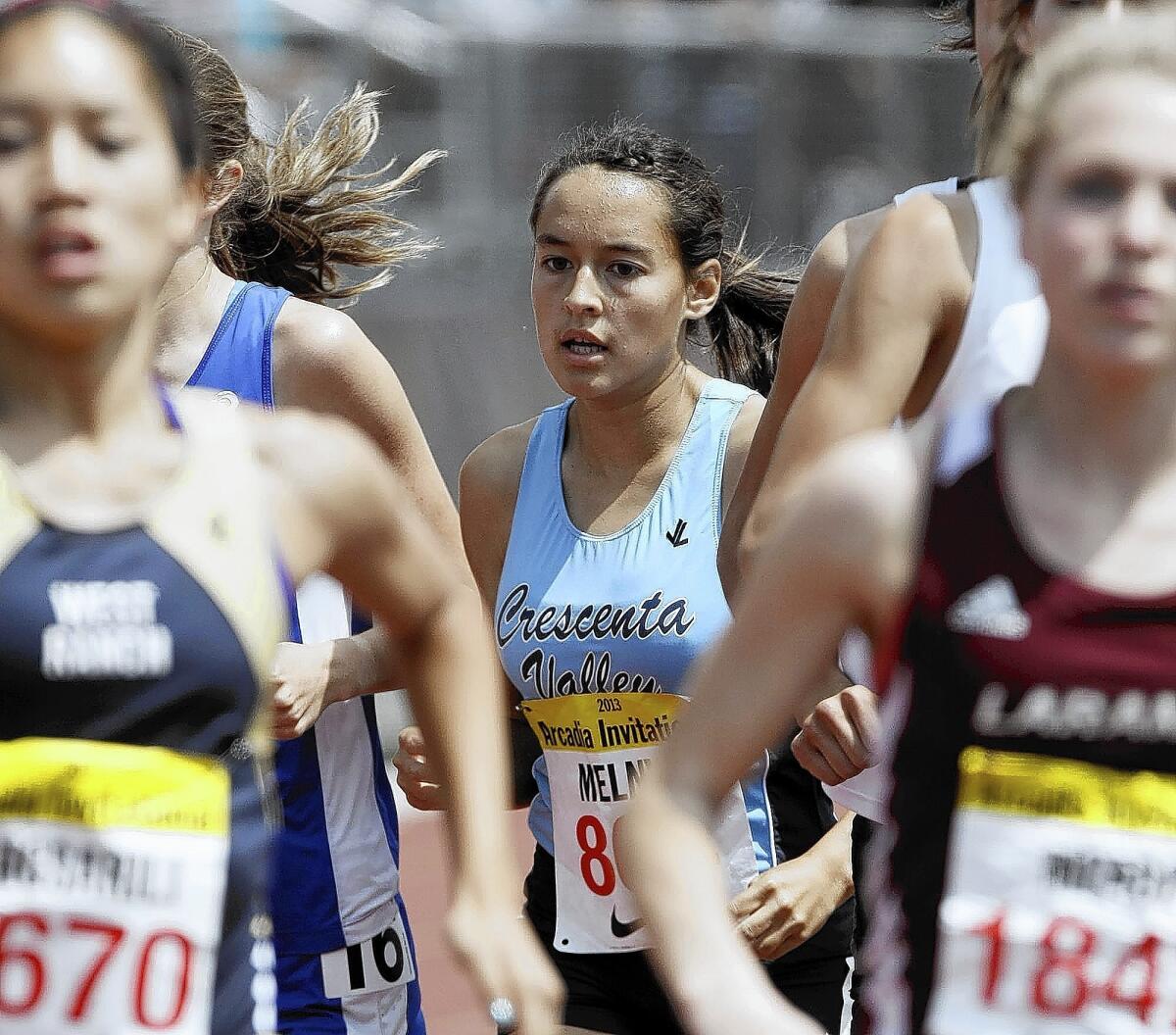 Crescenta Valley High's Megan Melnyk, center, competed in the Women's 800 meters race #2 at the Arcadia Invitational in Arcadia on Saturday, April 6, 2013.