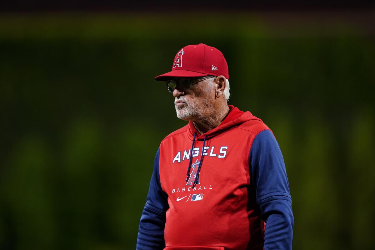 Angels manager Joe Maddon walks on the field during a baseball game June 3.