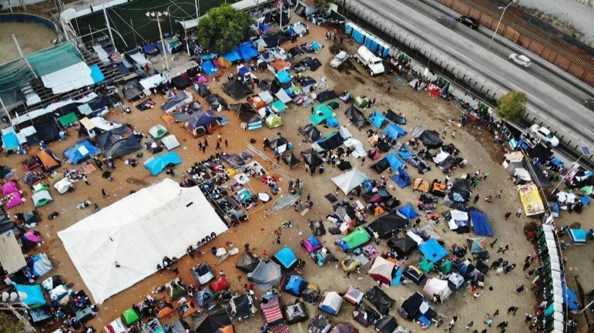 An aerial view of the temporary shelter set up for members of the "migrant caravan," with a section of the U.S.-Mexico border visible, in Tijuana on Nov. 24.