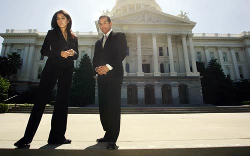 Villaraigosa and Salinas wait out a pause in filming on the north steps of the state Capitol. Salinas was a news anchor on Telemundo 52.