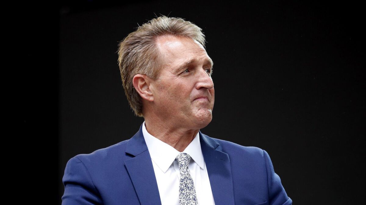 Sen. Jeff Flake listens to a question during an appearance at the Forbes 30 Under 30 Summit on Oct. 1 in Boston.