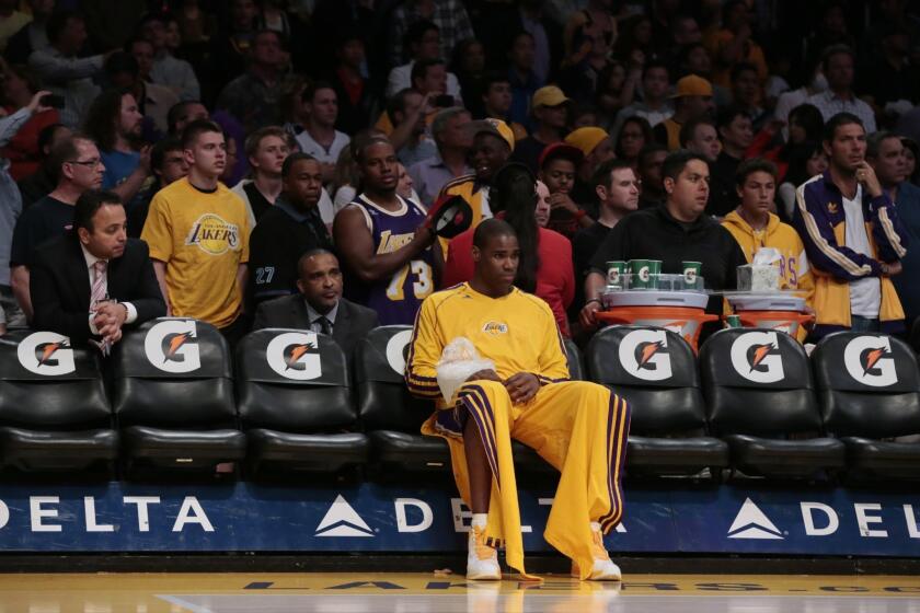 Lakers forward Antawn Jamison sits alone on the Lakers bench nursing an injured wrist.