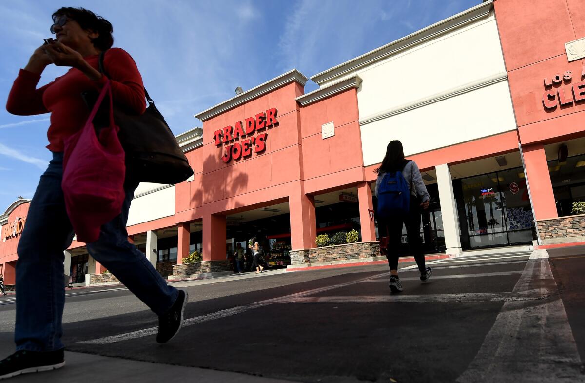 Pedestrians walk outside Trader Joe's in Long Beach, where two of the robberies occurred.