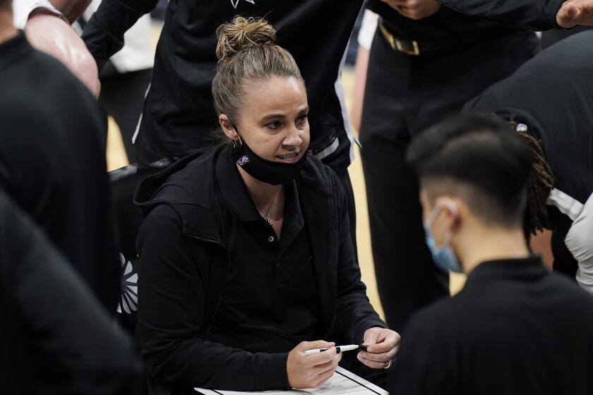 San Antonio Spurs assistant coach Becky Hammon calls a play during a timeout.