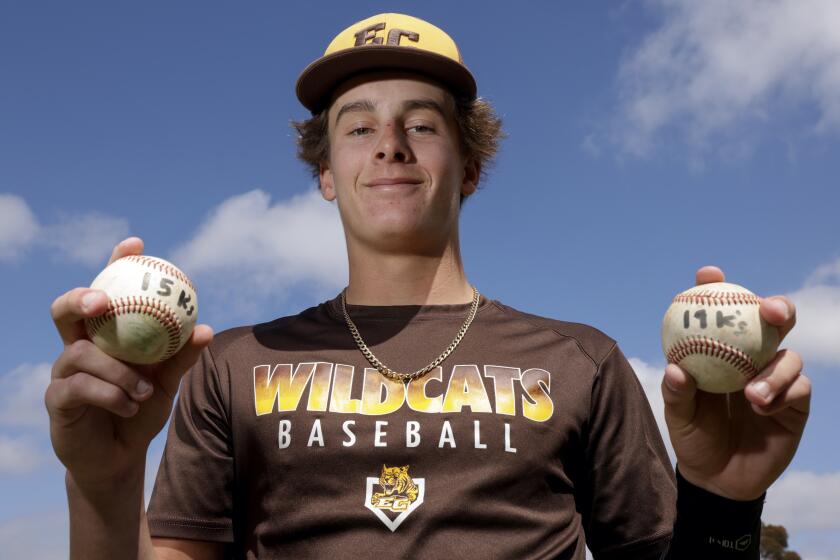 OCEANSIDE, CA - APRIL 24, 2024: El Camino pitcher Zane Nordquist holds his two no-hitter baseballs during practice at El Camino High School in Oceanside on Wednesday, April 24, 2024.