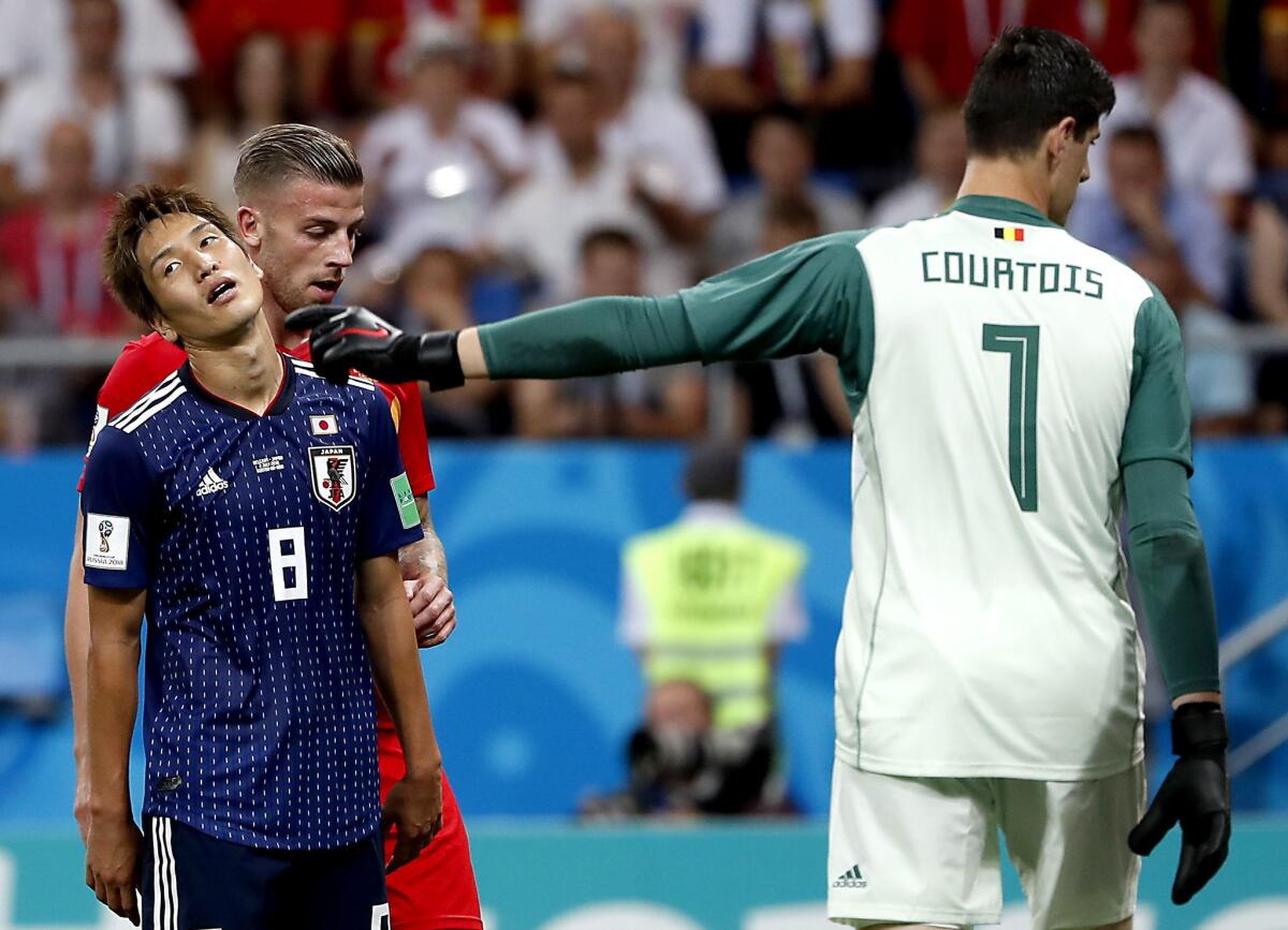 Goalkeeper Thibaut Courtois of Belgium (R) and Genki Haraguchi of Japan (L) react during the FIFA World Cup 2018 round of 16 soccer match between Belgium and Japan in Rostov-On-Don, Russia, 02 July 2018.