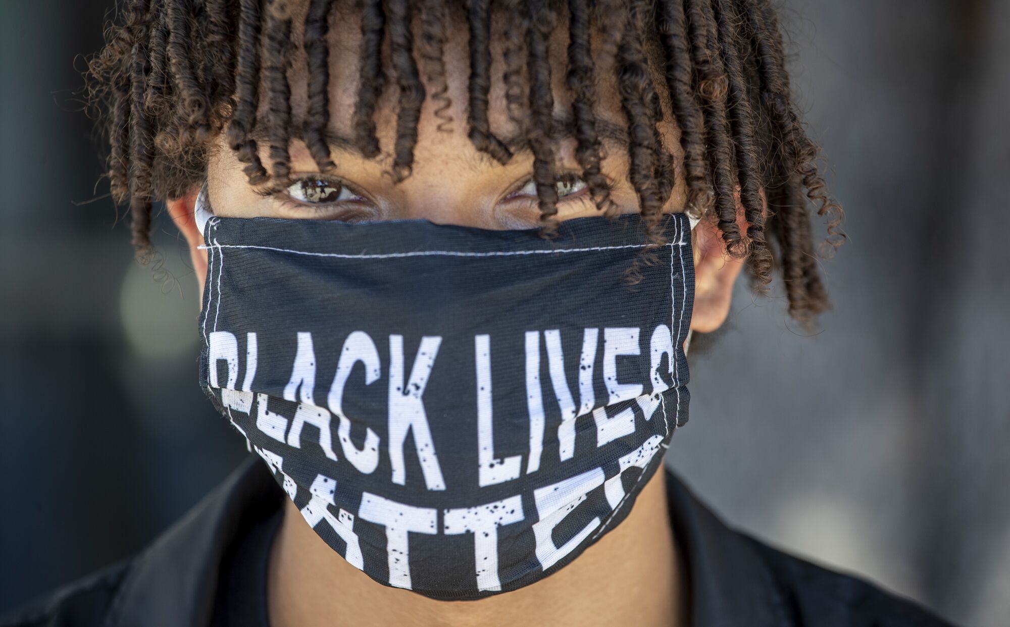 Junior Ashto Summers, 16, wears a Black Lives Matter mask