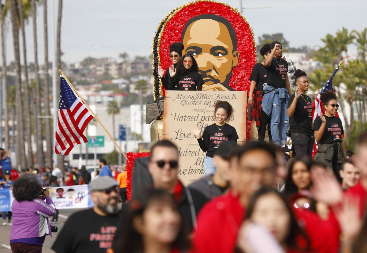A float from SDSU makes its way down Harbor Boulevard during the 40th Annual Martin Luther King Jr. Day Parade.