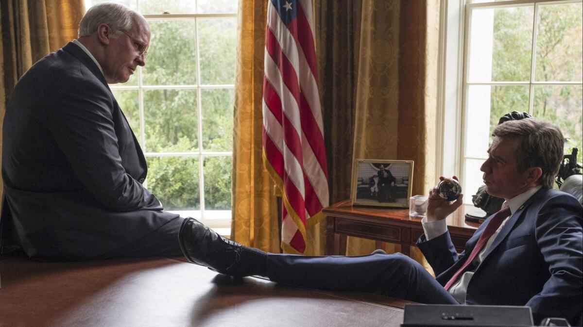 Christian Bale as Dick Cheney, left, and Sam Rockwell as George W. Bush in a scene from "Vice."