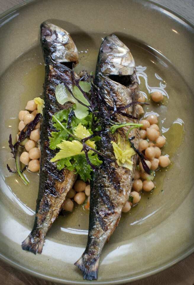 Grilled sardines are served with tondini beans at Cotogna.