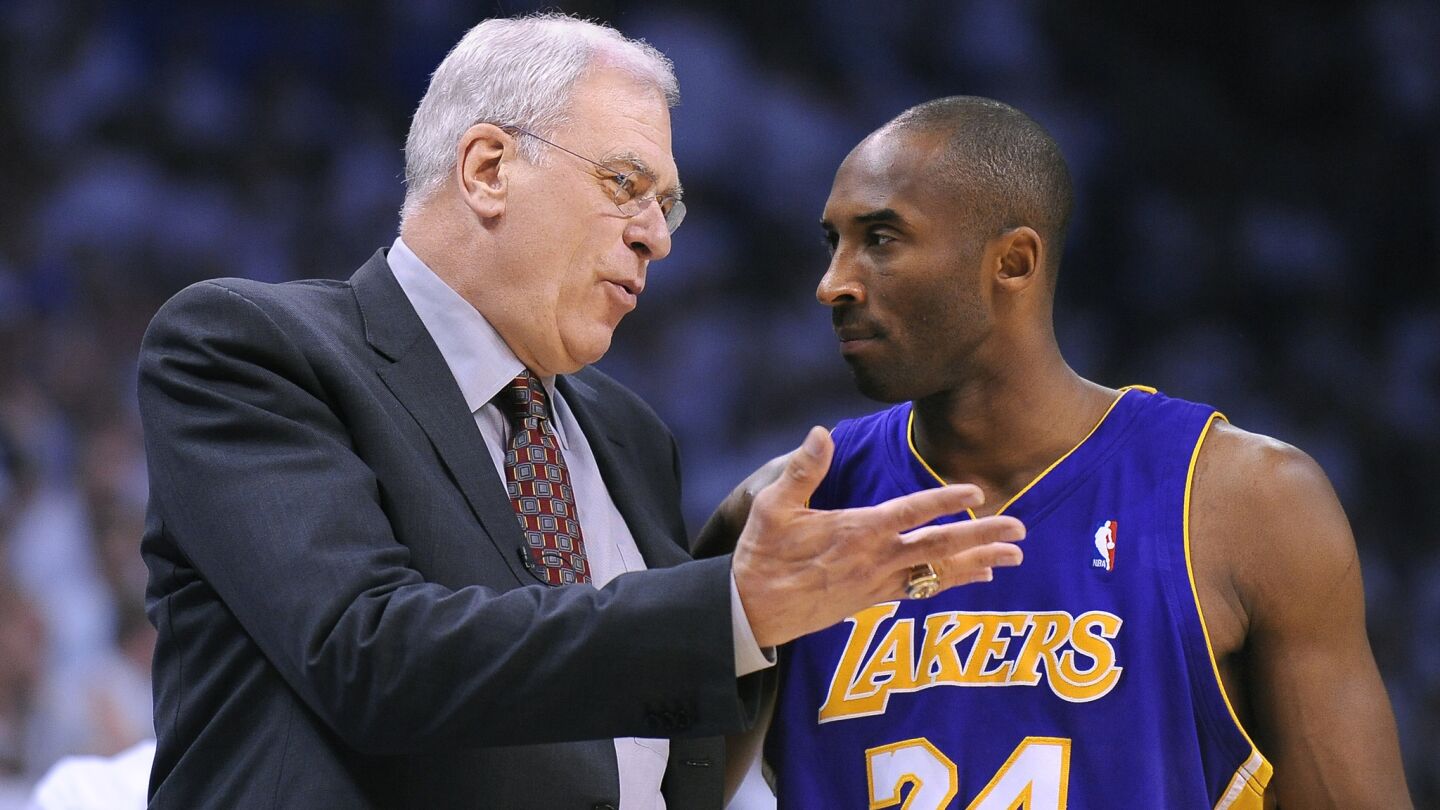 Lakers star Kobe Bryant, right, speaks with coach Phil Jackson in 2010.