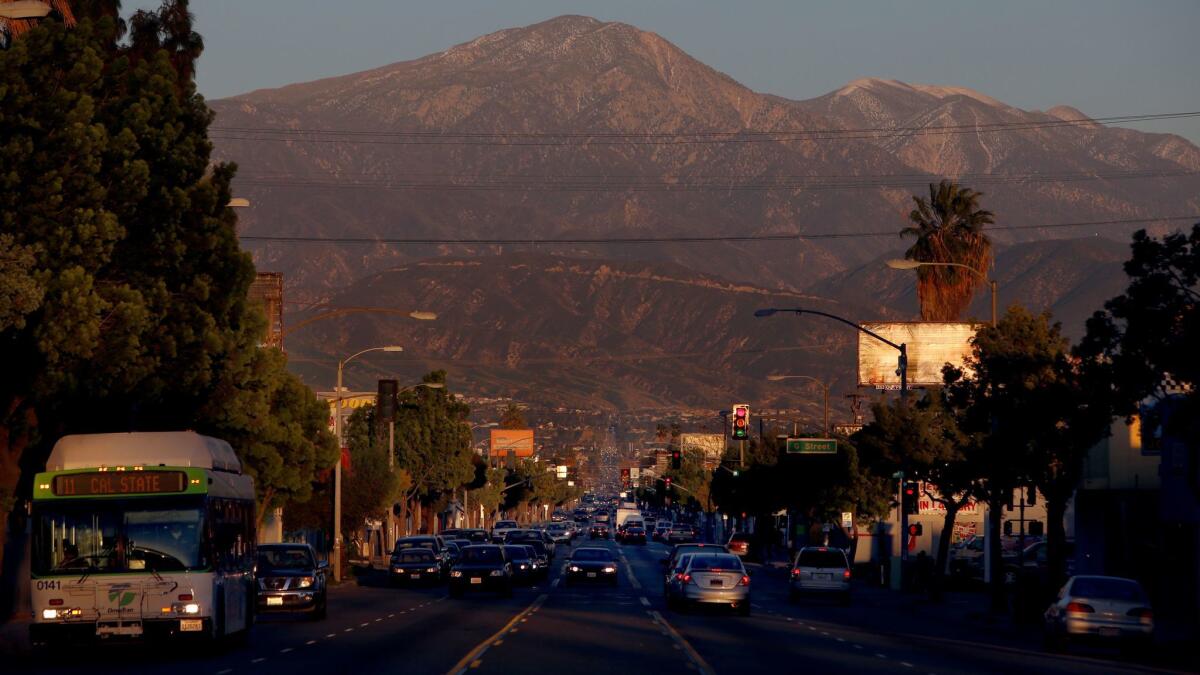 Dusk settles on Baseline Street in San Bernardino in February 2015. On June 15, 2017, the city officially emerged from bankruptcy, but it will probably continue to struggle to bring in revenue. (Francine Orr / Los Angeles Times)