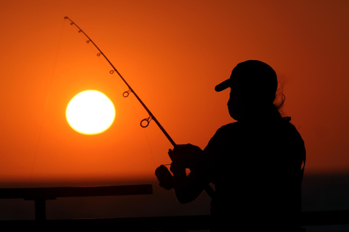 A fisherman at the Redondo Beach Pier