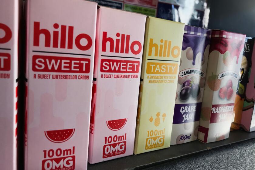 Flavored vaping products containing nicotine are seen in a store in Los Angeles, California, September 17, 2019. - New York became the second US state to ban flavored e-cigarettes Tuesday, following several deaths linked to vaping that have raised fears about a product long promoted as less harmful than smoking. (Photo by Robyn Beck / AFP) (Photo credit should read ROBYN BECK/AFP/Getty Images)