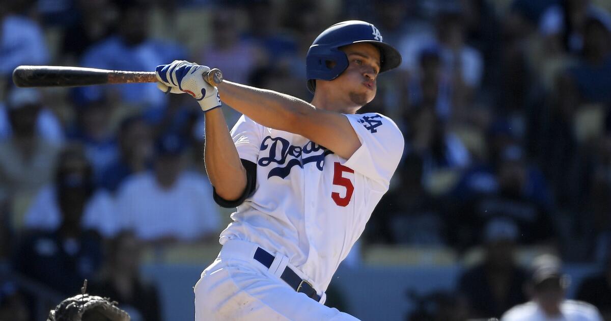 Dodgers shortstop Corey Seager swings at a pitch against the Cardinals.