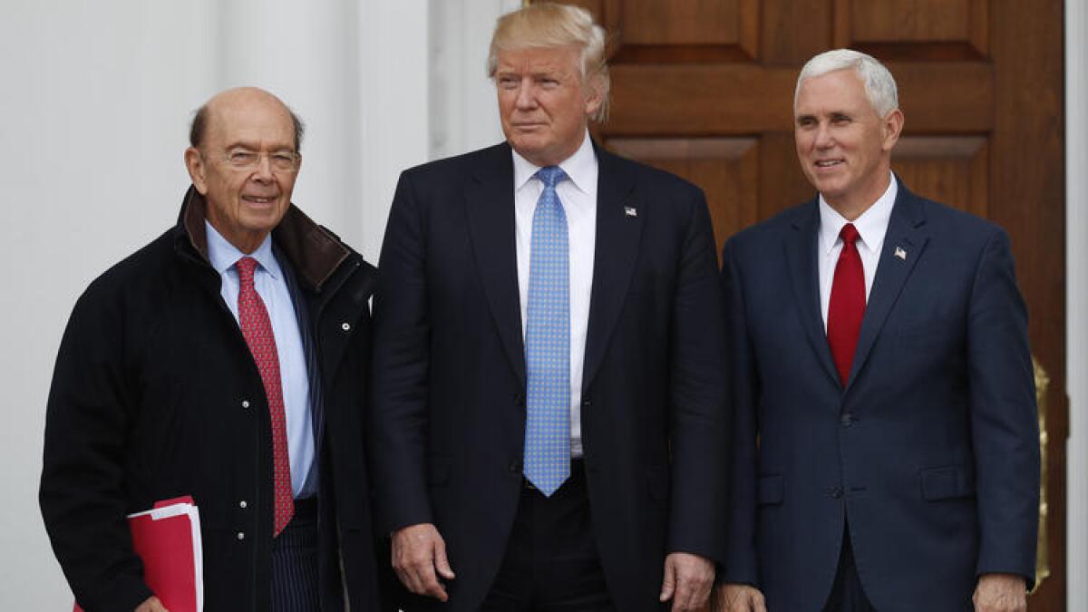 President-elect Donald Trump and Vice President-elect Mike Pence greet investor Wilbur Ross, left, in New Jersey on Sunday.