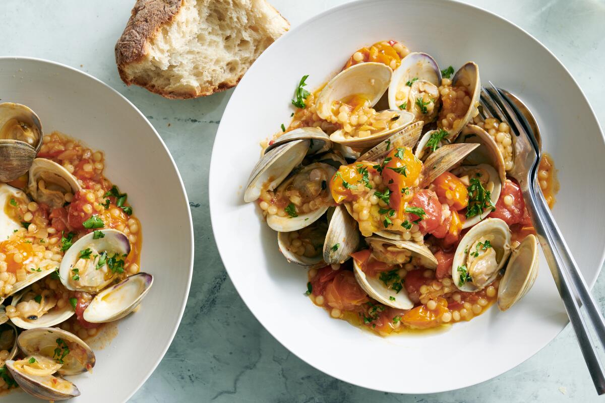 Littleneck clams with cherry tomatoes and pearl couscous.