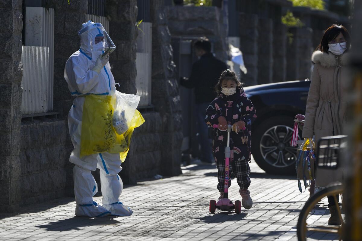 People wearing masks on a Beijing street