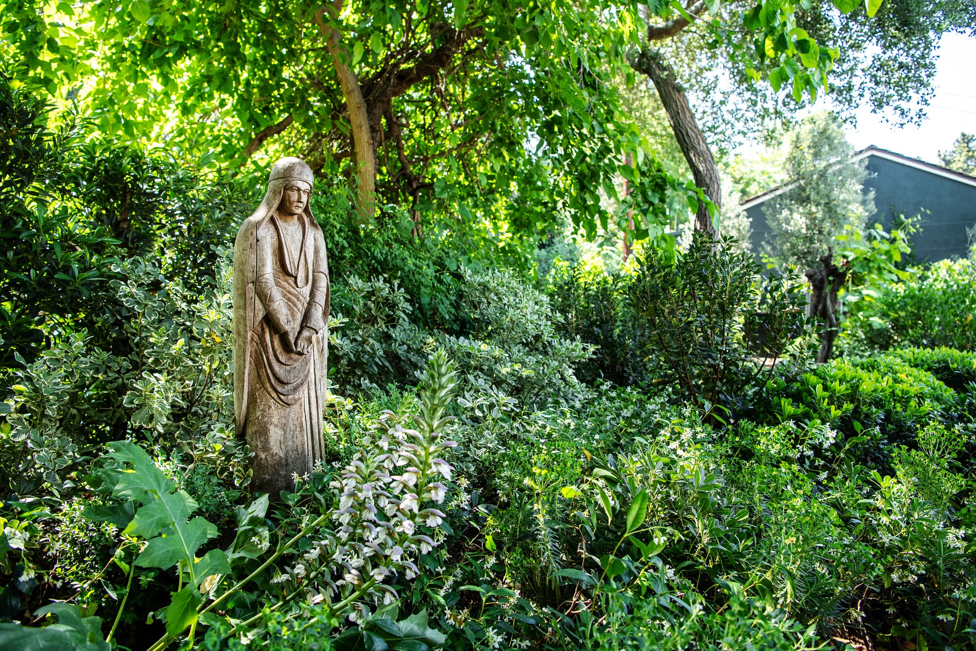 A statue in a garden 
