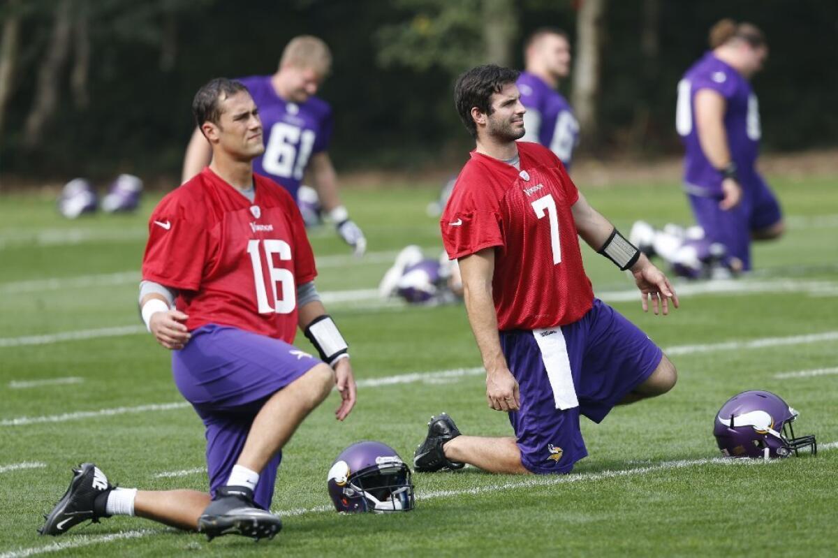 Vikings quarterbacks Christian Ponder, left, and Matt Cassel stretch during practice on Wednesday.