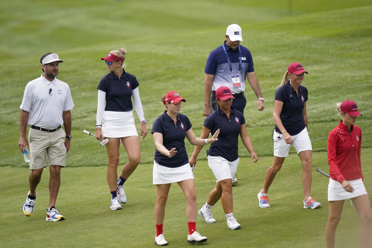 From left, Bubba Watson, Jessica Korda, Ally Ewing, Megan Khang, Morgan Pressel and Nelly Korda approach the seventh green during practice for the Solheim Cup golf tournament, Friday, Sept. 3, 2021, in Toledo, Ohio. (AP Photo/Carlos Osorio)